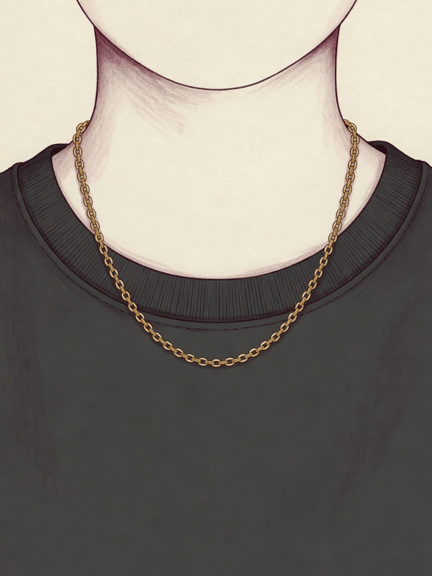 A gold necklace on a neck